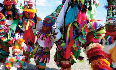 Traditional cultural dancers of all ages in brightly coloured outfits